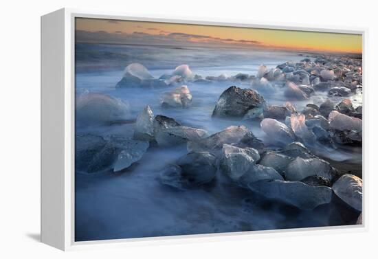 Pieces of glacial ice over black sand being washed by waves, Iceland-Raul Touzon-Framed Premier Image Canvas