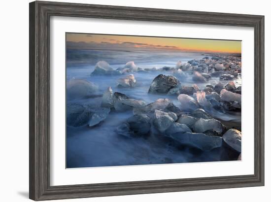 Pieces of glacial ice over black sand being washed by waves, Iceland-Raul Touzon-Framed Photographic Print