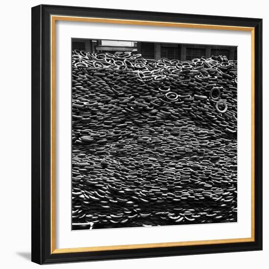 Pile of New and Used Tires over 40 Feet Deep at the B.F. Goodrich Yard-William C^ Shrout-Framed Photographic Print