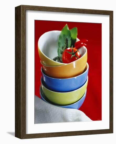 Pile of Soup Bowls with Tomato, Bay Leaf and Chilis-Karl Newedel-Framed Photographic Print
