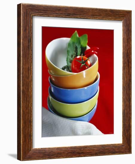 Pile of Soup Bowls with Tomato, Bay Leaf and Chilis-Karl Newedel-Framed Photographic Print