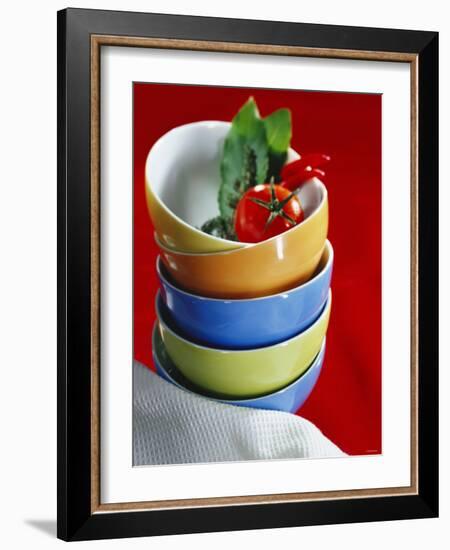 Pile of Soup Bowls with Tomato, Bay Leaf and Chilis-Karl Newedel-Framed Photographic Print