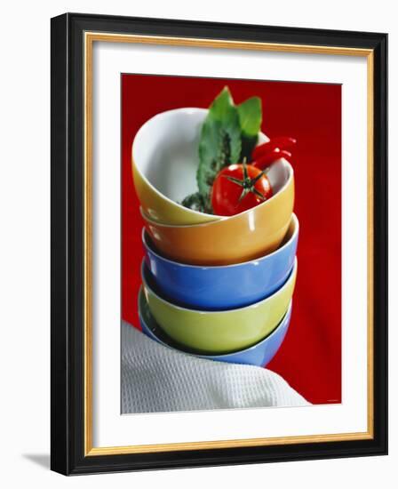 Pile of Soup Bowls with Tomato, Bay Leaf and Chilis-Karl Newedel-Framed Photographic Print