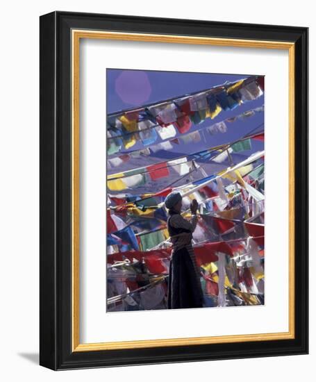 Pilgrim Praying Among Flags, Tibet-Keren Su-Framed Photographic Print