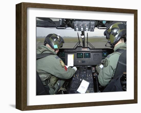 Pilots Inside the Cockpit of a Royal Air Force Merlin Helicopter at RAF Lyneham-Stocktrek Images-Framed Photographic Print