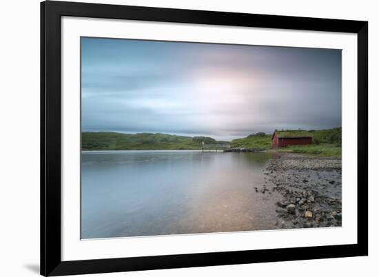 Pink lights of the midnight sun illuminate sea and the typical rorbu, Holdalsvatnet, Vestvagoy, Lof-Roberto Moiola-Framed Photographic Print