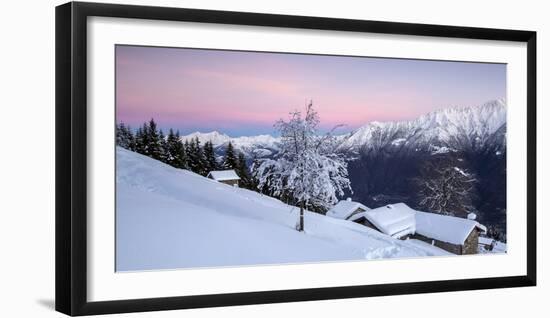 Pink Sky at Dawn Above Snow Covered Huts and Trees, Orobie Alps-Roberto Moiola-Framed Photographic Print