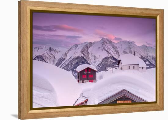 Pink Sky at Sunset Frames the Snowy Mountain Huts and Church, Bettmeralp, District of Raron-Roberto Moiola-Framed Premier Image Canvas