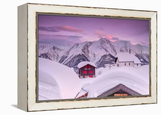 Pink Sky at Sunset Frames the Snowy Mountain Huts and Church, Bettmeralp, District of Raron-Roberto Moiola-Framed Premier Image Canvas