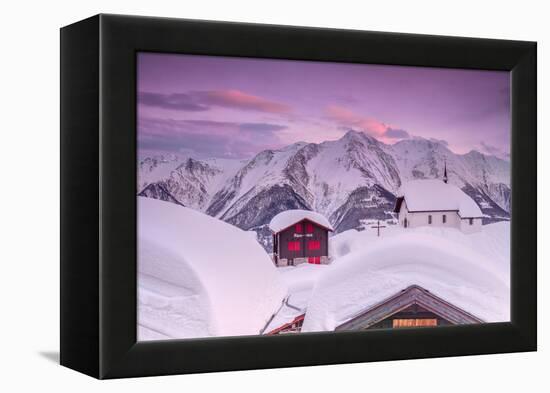 Pink Sky at Sunset Frames the Snowy Mountain Huts and Church, Bettmeralp, District of Raron-Roberto Moiola-Framed Premier Image Canvas