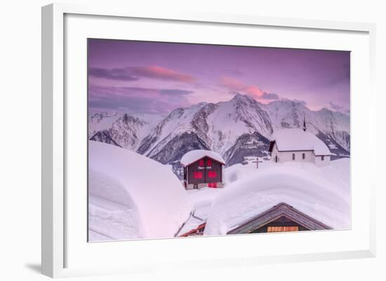 Pink Sky at Sunset Frames the Snowy Mountain Huts and Church, Bettmeralp, District of Raron-Roberto Moiola-Framed Photographic Print