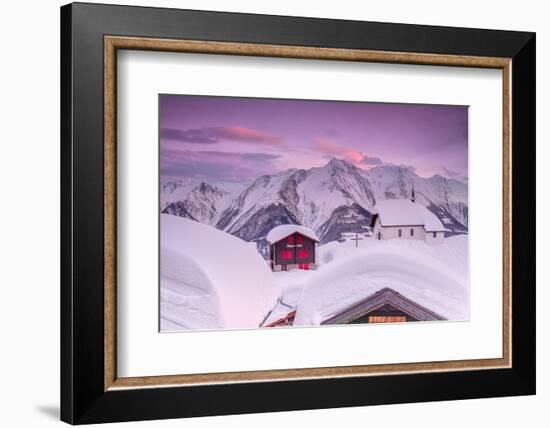 Pink Sky at Sunset Frames the Snowy Mountain Huts and Church, Bettmeralp, District of Raron-Roberto Moiola-Framed Photographic Print