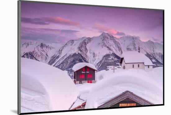 Pink Sky at Sunset Frames the Snowy Mountain Huts and Church, Bettmeralp, District of Raron-Roberto Moiola-Mounted Photographic Print