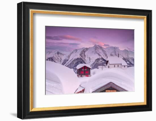 Pink Sky at Sunset Frames the Snowy Mountain Huts and Church, Bettmeralp, District of Raron-Roberto Moiola-Framed Photographic Print