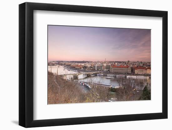 Pink sky on historical bridges and buildings reflected on Vltava River at sunset, Prague, Czech Rep-Roberto Moiola-Framed Photographic Print