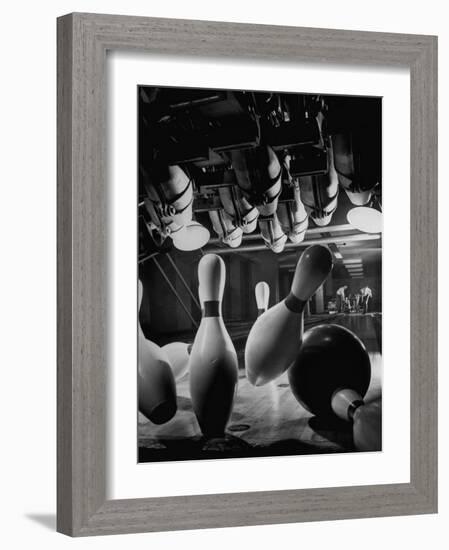 Pins Falling after Being Struck by Bowling Ball-null-Framed Photographic Print