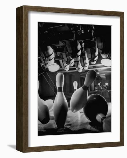 Pins Falling after Being Struck by Bowling Ball-null-Framed Photographic Print