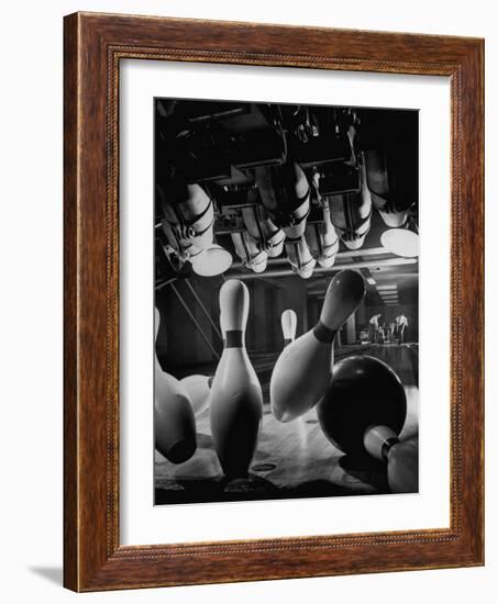 Pins Falling after Being Struck by Bowling Ball-null-Framed Photographic Print