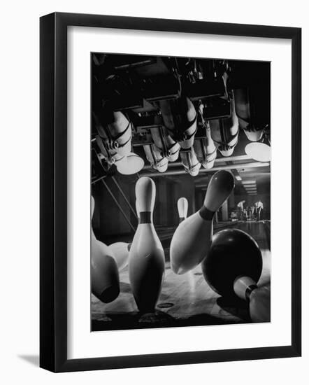 Pins Falling after Being Struck by Bowling Ball-null-Framed Photographic Print