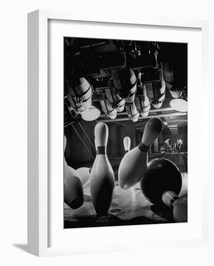 Pins Falling after Being Struck by Bowling Ball-null-Framed Photographic Print