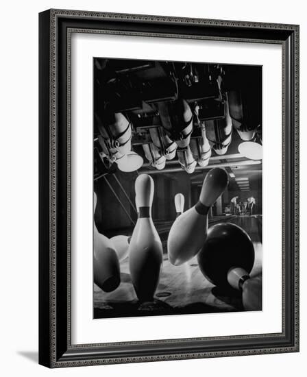 Pins Falling after Being Struck by Bowling Ball-null-Framed Photographic Print