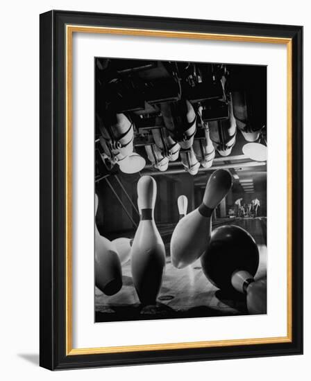 Pins Falling after Being Struck by Bowling Ball-null-Framed Photographic Print