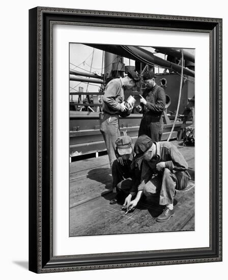 Pipefitters and Welders Discussing Installation During Shipbuilding Process-George Strock-Framed Photographic Print