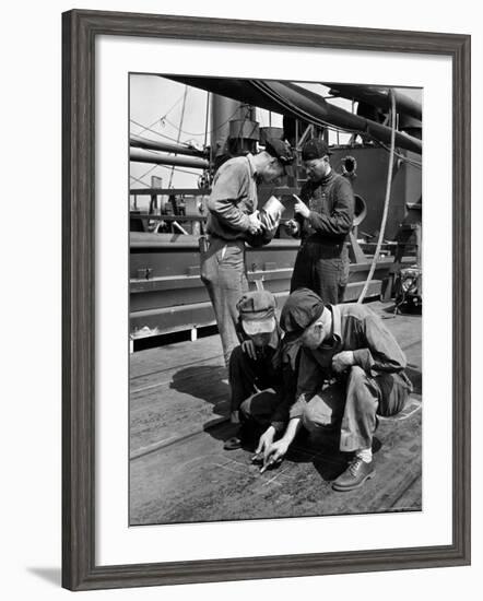 Pipefitters and Welders Discussing Installation During Shipbuilding Process-George Strock-Framed Photographic Print