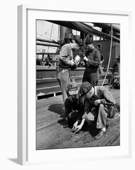 Pipefitters and Welders Discussing Installation During Shipbuilding Process-George Strock-Framed Photographic Print