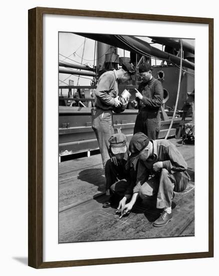 Pipefitters and Welders Discussing Installation During Shipbuilding Process-George Strock-Framed Photographic Print