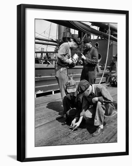 Pipefitters and Welders Discussing Installation During Shipbuilding Process-George Strock-Framed Photographic Print