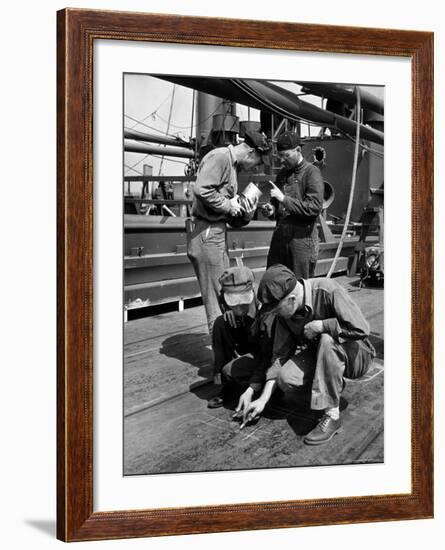 Pipefitters and Welders Discussing Installation During Shipbuilding Process-George Strock-Framed Photographic Print