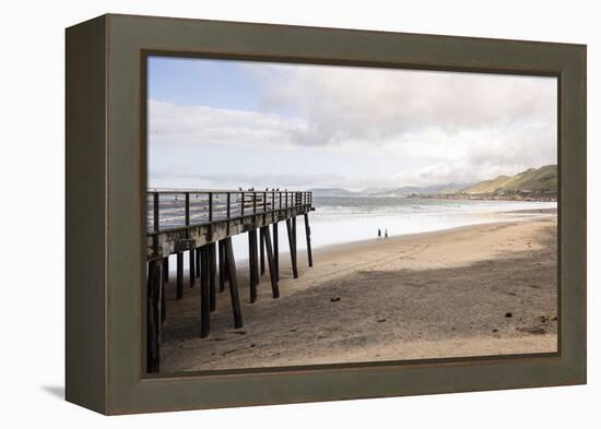 Pismo Beach Pier, California, USA: A Man And A Woman Walking Along The Beach-Axel Brunst-Framed Premier Image Canvas