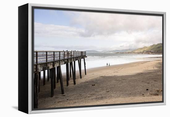 Pismo Beach Pier, California, USA: A Man And A Woman Walking Along The Beach-Axel Brunst-Framed Premier Image Canvas