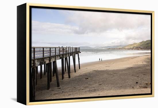 Pismo Beach Pier, California, USA: A Man And A Woman Walking Along The Beach-Axel Brunst-Framed Premier Image Canvas