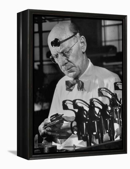Pistol Engraver Harry Jarvis Disassembling Revolver at Smith and Wesson's Gunmaking Plant-Margaret Bourke-White-Framed Premier Image Canvas