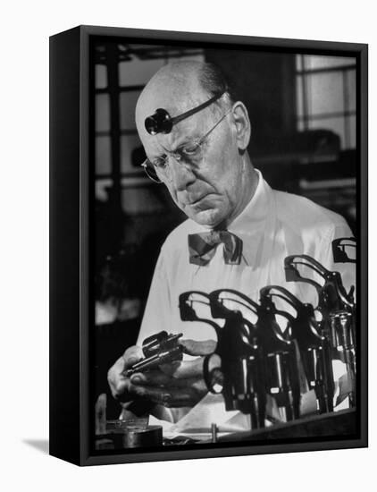 Pistol Engraver Harry Jarvis Disassembling Revolver at Smith and Wesson's Gunmaking Plant-Margaret Bourke-White-Framed Premier Image Canvas