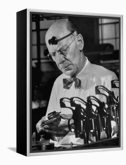 Pistol Engraver Harry Jarvis Disassembling Revolver at Smith and Wesson's Gunmaking Plant-Margaret Bourke-White-Framed Premier Image Canvas