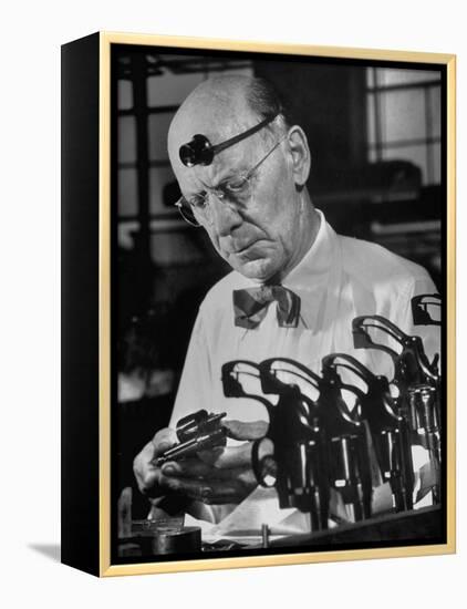 Pistol Engraver Harry Jarvis Disassembling Revolver at Smith and Wesson's Gunmaking Plant-Margaret Bourke-White-Framed Premier Image Canvas