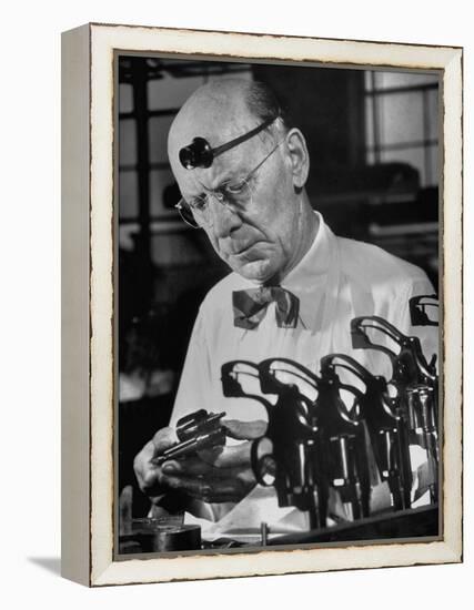 Pistol Engraver Harry Jarvis Disassembling Revolver at Smith and Wesson's Gunmaking Plant-Margaret Bourke-White-Framed Premier Image Canvas