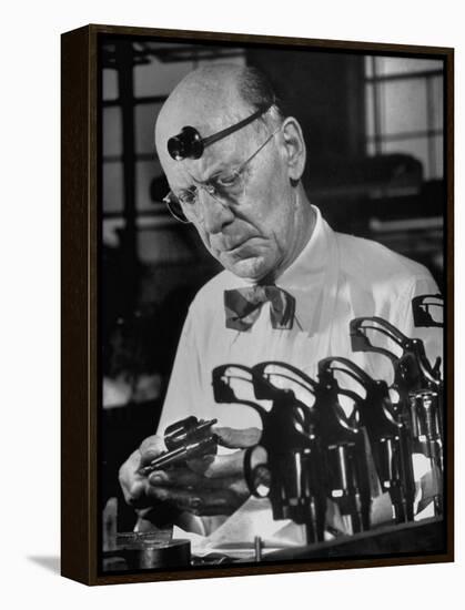 Pistol Engraver Harry Jarvis Disassembling Revolver at Smith and Wesson's Gunmaking Plant-Margaret Bourke-White-Framed Premier Image Canvas