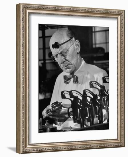 Pistol Engraver Harry Jarvis Disassembling Revolver at Smith and Wesson's Gunmaking Plant-Margaret Bourke-White-Framed Photographic Print