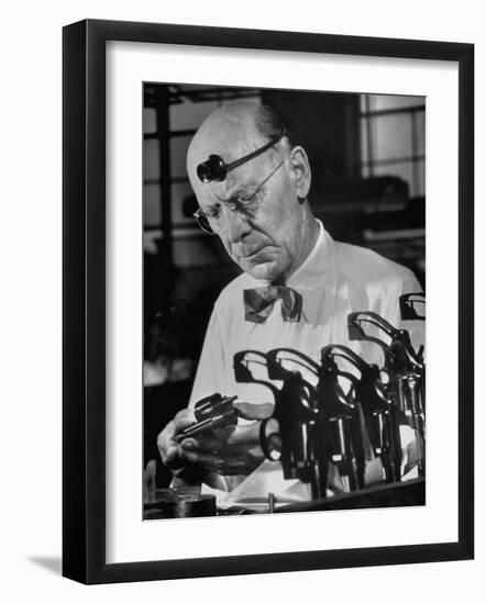 Pistol Engraver Harry Jarvis Disassembling Revolver at Smith and Wesson's Gunmaking Plant-Margaret Bourke-White-Framed Photographic Print