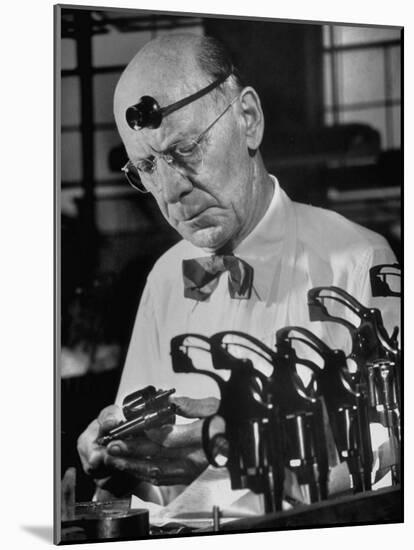 Pistol Engraver Harry Jarvis Disassembling Revolver at Smith and Wesson's Gunmaking Plant-Margaret Bourke-White-Mounted Photographic Print