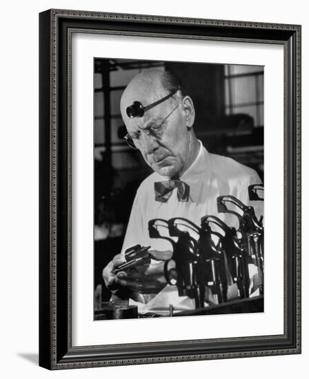 Pistol Engraver Harry Jarvis Disassembling Revolver at Smith and Wesson's Gunmaking Plant-Margaret Bourke-White-Framed Photographic Print