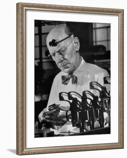 Pistol Engraver Harry Jarvis Disassembling Revolver at Smith and Wesson's Gunmaking Plant-Margaret Bourke-White-Framed Photographic Print