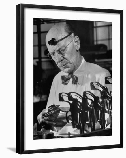 Pistol Engraver Harry Jarvis Disassembling Revolver at Smith and Wesson's Gunmaking Plant-Margaret Bourke-White-Framed Photographic Print