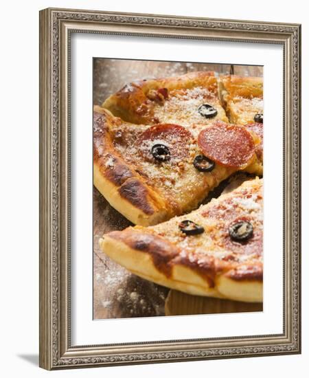 Pizza with Salami, Cheese and Olives, Pieces Cut-null-Framed Photographic Print