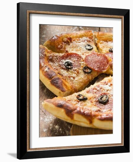 Pizza with Salami, Cheese and Olives, Pieces Cut-null-Framed Photographic Print