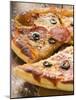 Pizza with Salami, Cheese and Olives, Pieces Cut-null-Mounted Photographic Print